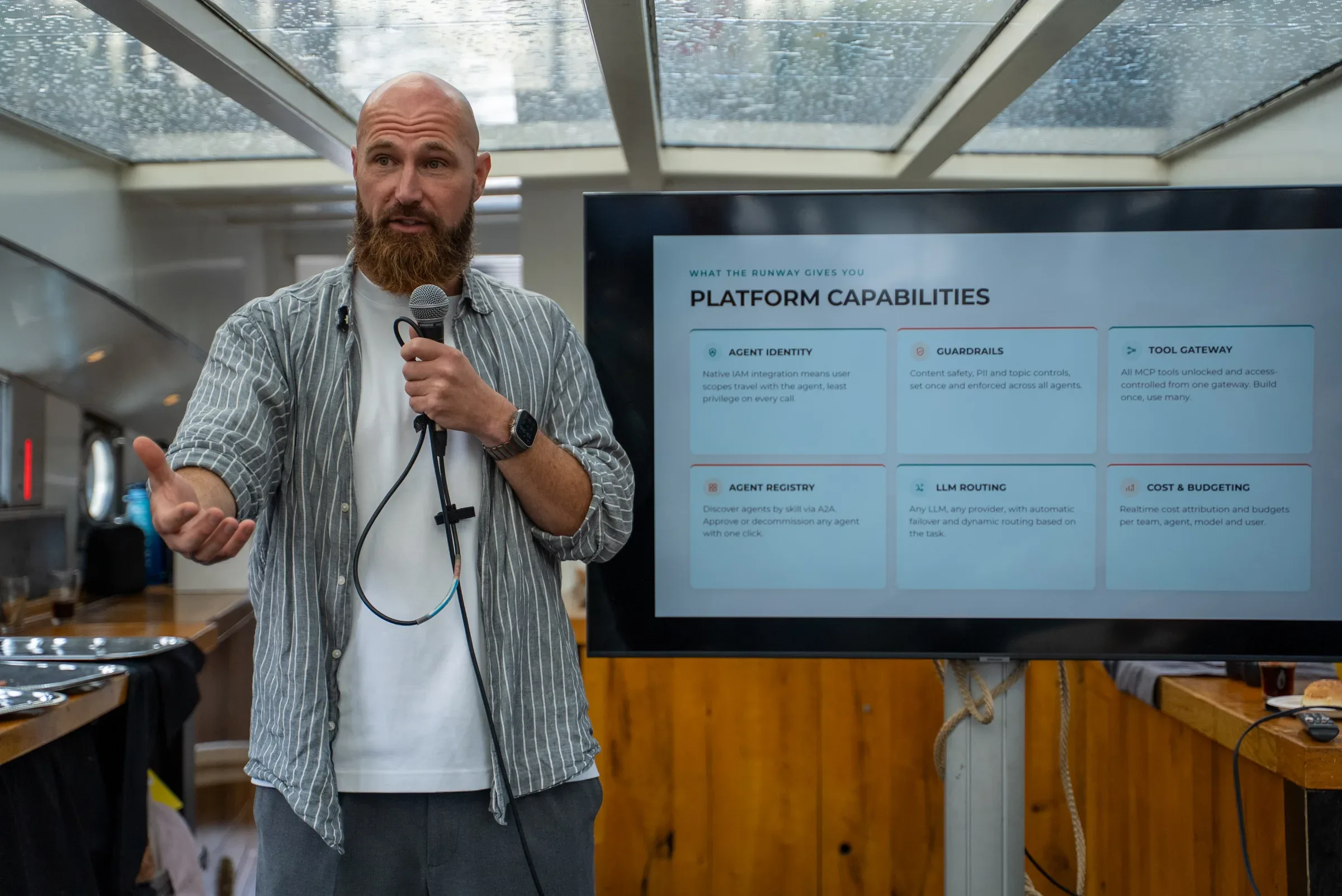 Carsten Klomp presenting on scaling Agentic AI, in front of the platform capabilities slide